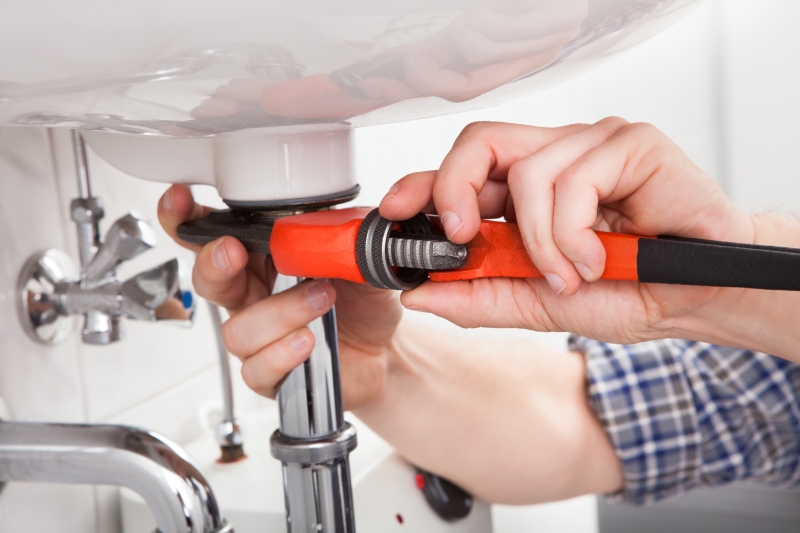 Emergency plumber attending a job in Teddington